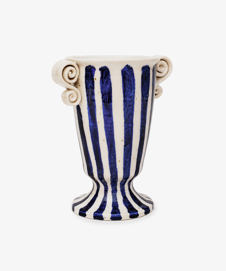 The Thallo Pedestal Vase by George Bronwin features bold cobalt stripes, two curled handles, and stands on a flared base against a white background.