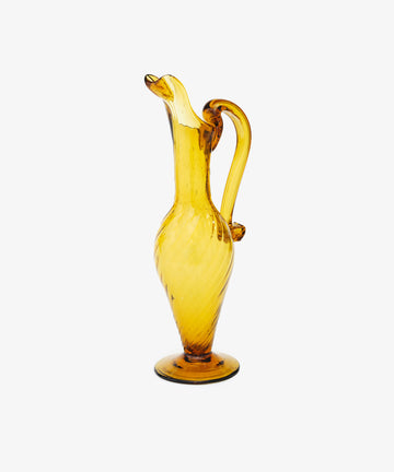 Alba Vase. Transparent bright yellow handblown glass vase with tall, elongated pitcher shape. Side angled view.