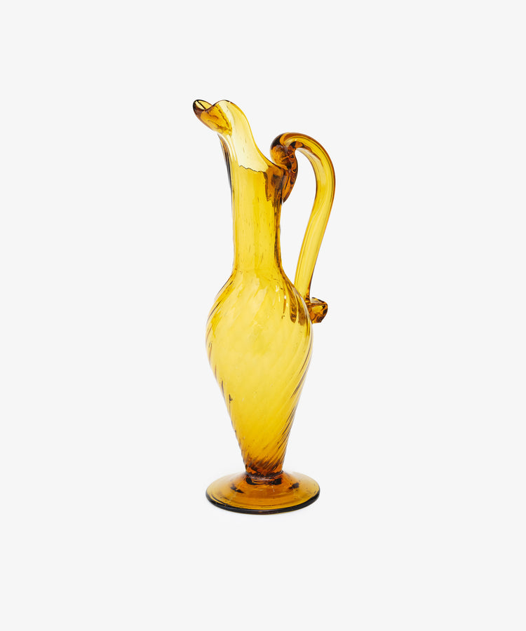 Alba Vase. Transparent bright yellow handblown glass vase with tall, elongated pitcher shape. Side angled view.