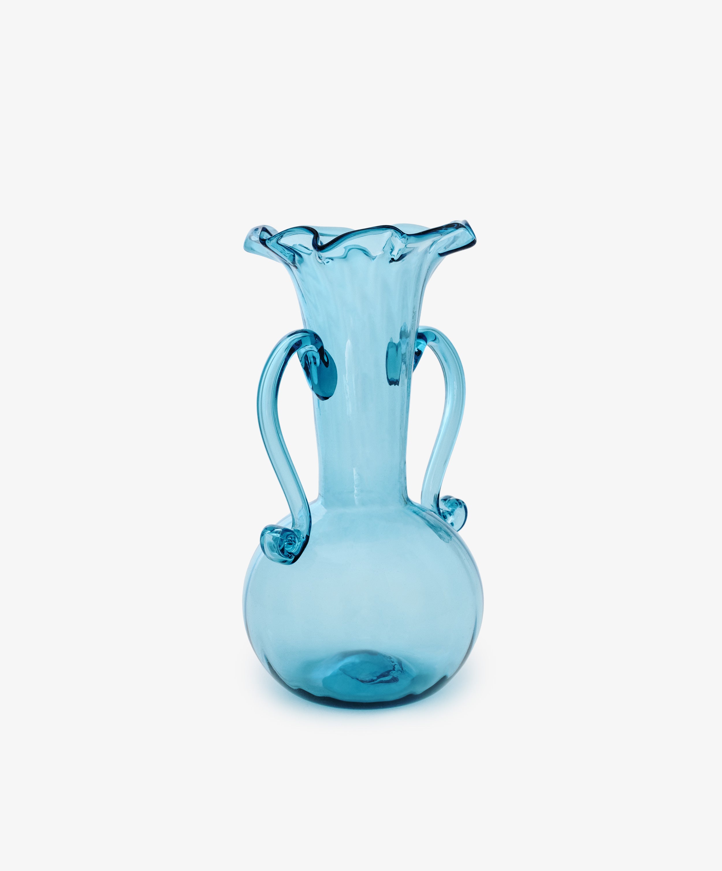 The Camilla Vase is a blue hand-blown glass piece with a round base, two curved handles, and a flared ruffled rim—ideal for collectors seeking unique vases.