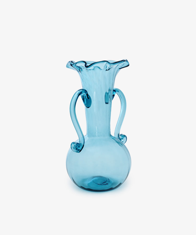 The Camilla Vase is a blue hand-blown glass piece with a round base, two curved handles, and a flared ruffled rim—ideal for collectors seeking unique vases.