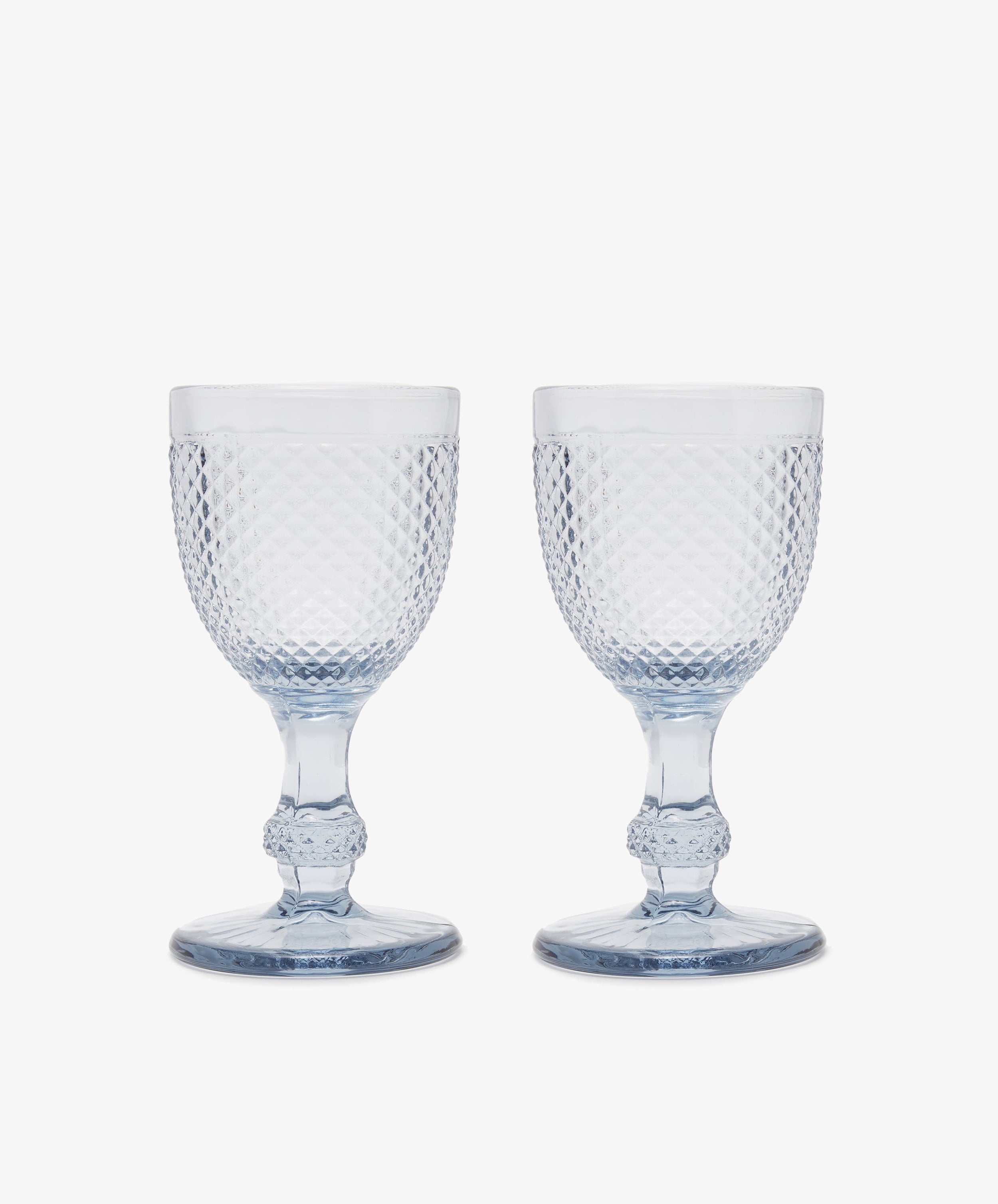 Celeste Red Wine Glass. Two transparent grey-blue stemmed wine glasses with diamond cut surface.