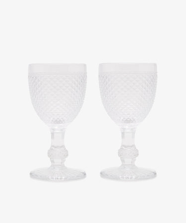 Celeste Red Wine Glass. Two transparent stemmed wine glasses with diamond cut surface.