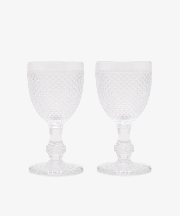 Celeste Red Wine Glass. Two transparent stemmed wine glasses with diamond cut surface.