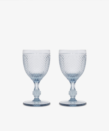 A set of Celeste White Wine Glasses with short stems and diamond-cut textured surfaces is displayed side by side on a plain white background.