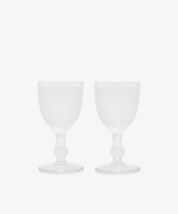 The Celeste White Wine Glass set of 6 features elegant, clear glasses with a diamond-cut textured design and short stems, displayed side by side on a plain white background.