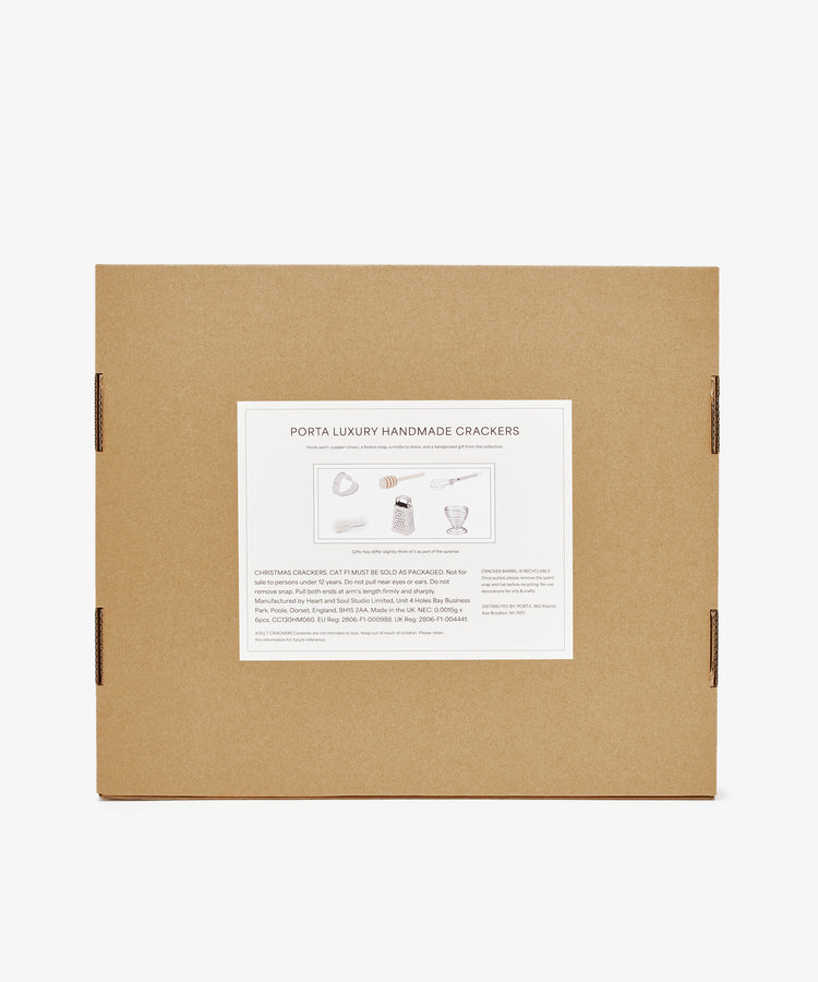 A brown cardboard box with a white label reading Capriccio Christmas Crackers, featuring product details and festive illustrations—ideal as holiday table crackers or Christmas party favors.