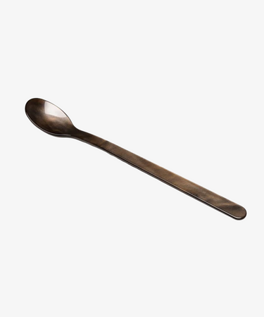 The Lungo Spoon is a long, slender metal spoon with an oval-shaped bowl, ideal for savoring ice cream sundaes or tall cocktails, displayed on a plain white background.