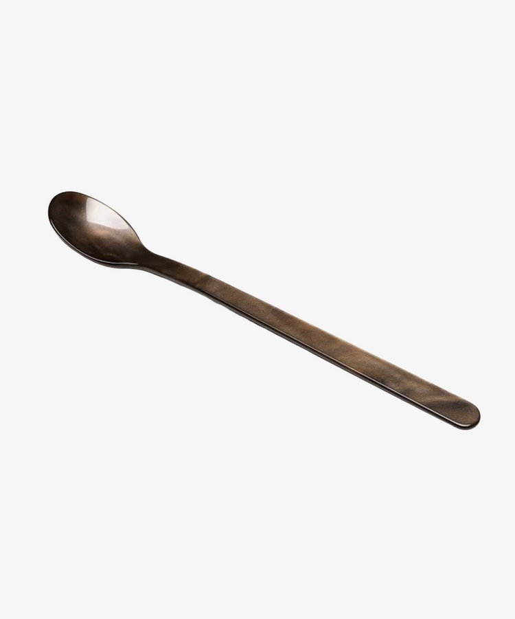 The Lungo Spoon is a long, slender metal spoon with an oval-shaped bowl, ideal for savoring ice cream sundaes or tall cocktails, displayed on a plain white background.