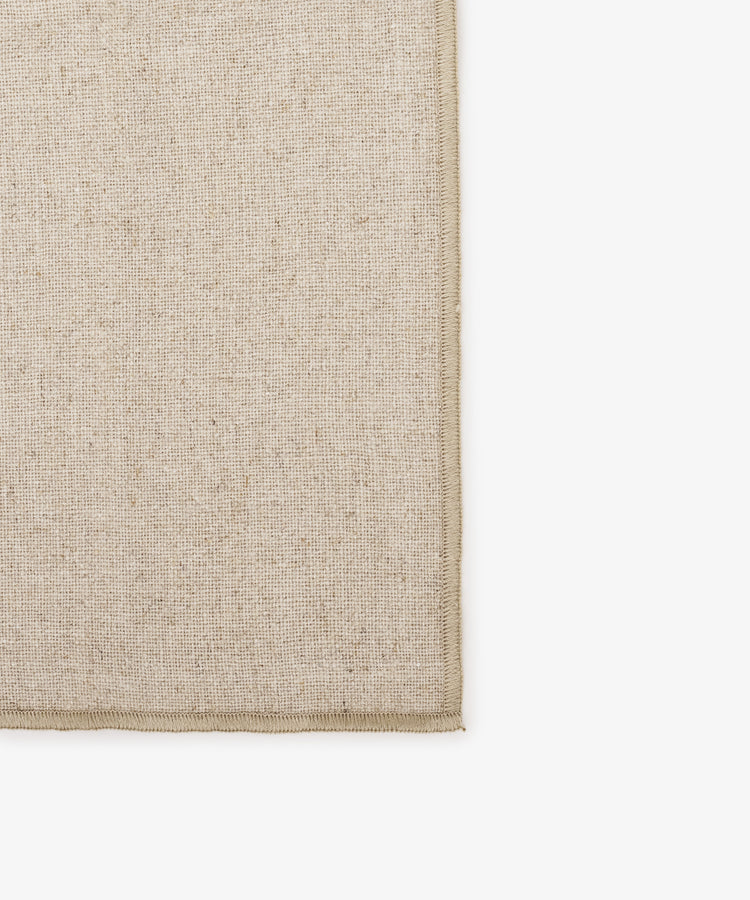 Close-up of eco-friendly, high-quality Corte Napkin (Set of 6) linen fabric with finished edges, photographed against a white background—ideal for elegant table settings.