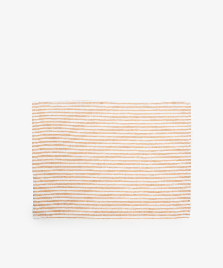 Vezzani Placemat. Rectangular mat in orange and white striped linen.