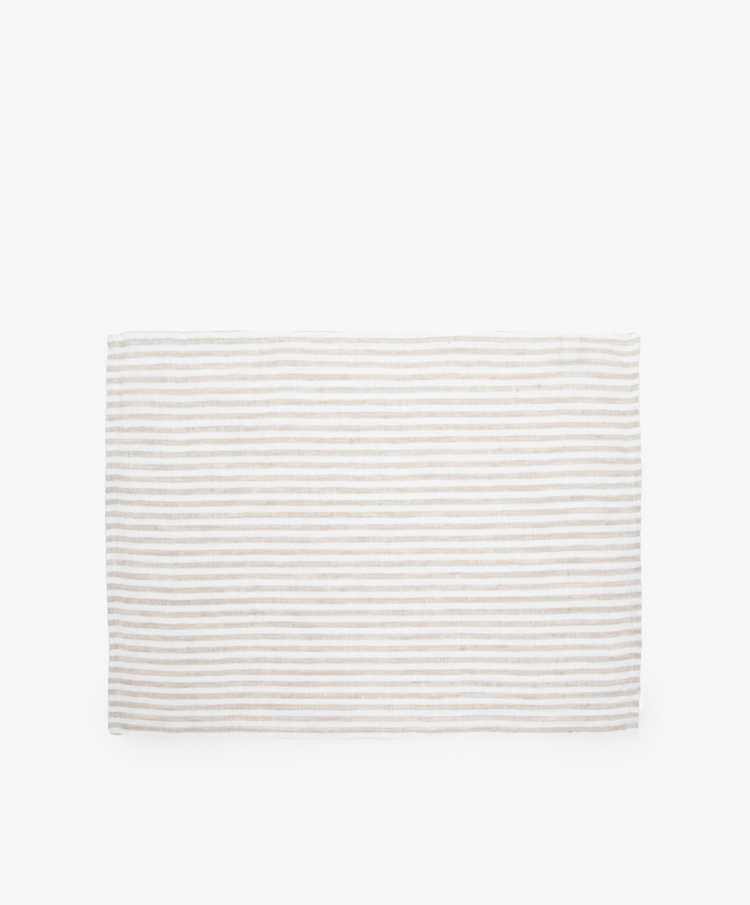 Vezzani Placemat. Rectangular mat in cream and white striped linen. 