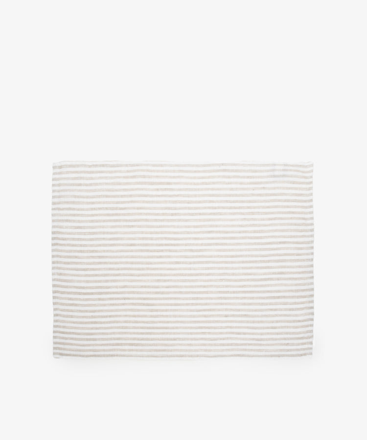 Vezzani Placemat. Rectangular mat in cream and white striped linen. 