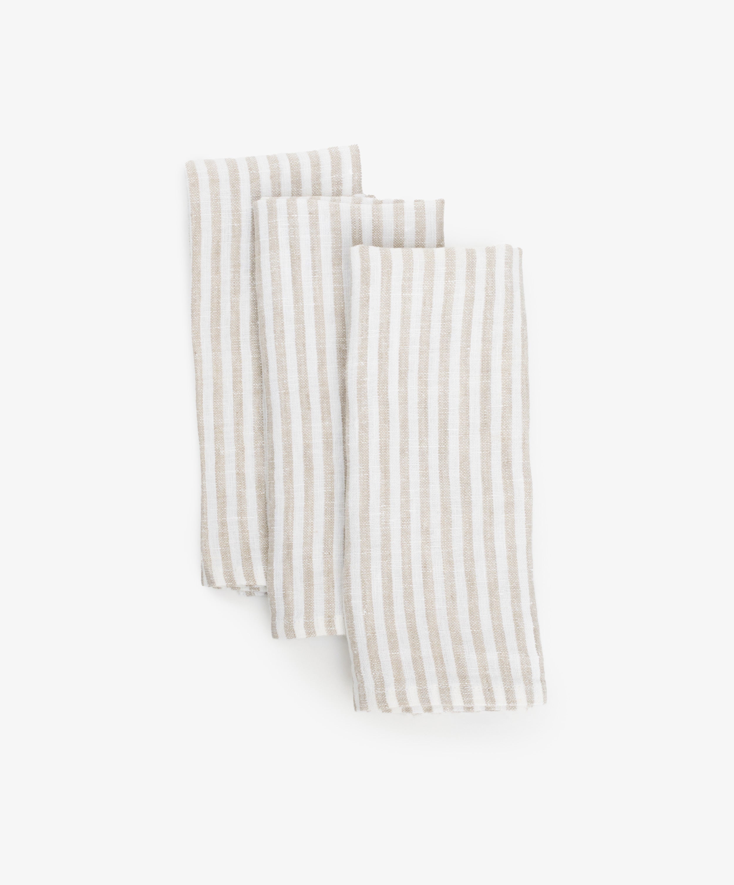 Vezzani Napkins. Set of six folded napkins in cream and white striped linen. 