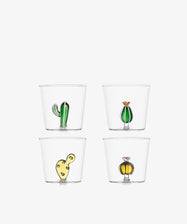 The Agave Tumbler Set of 4 features clear borosilicate glasses, each with a distinct colorful cactus or plant design at the base, arranged in a two-by-two grid on white—unique pieces to add charm to any table setting.