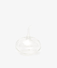 The Cylinder Oil & Vinegar Cruet features clear glass with a rounded base and curved spout, reminiscent of elegant cruets, displayed against a plain white background.
