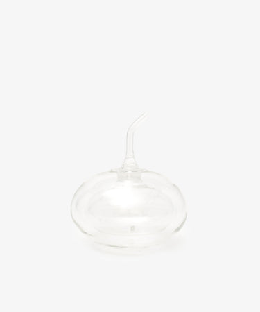 The Cylinder Oil & Vinegar Cruet features clear glass with a rounded base and curved spout, reminiscent of elegant cruets, displayed against a plain white background.