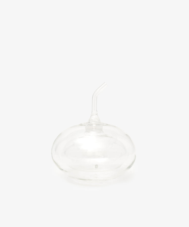 The Cylinder Oil & Vinegar Cruet features clear glass with a rounded base and curved spout, reminiscent of elegant cruets, displayed against a plain white background.