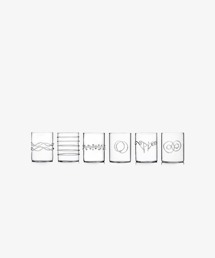 Deco Water Glass by Ichendorf Milano. Line of six transparent tumbler glasses with varying glass embellishments.