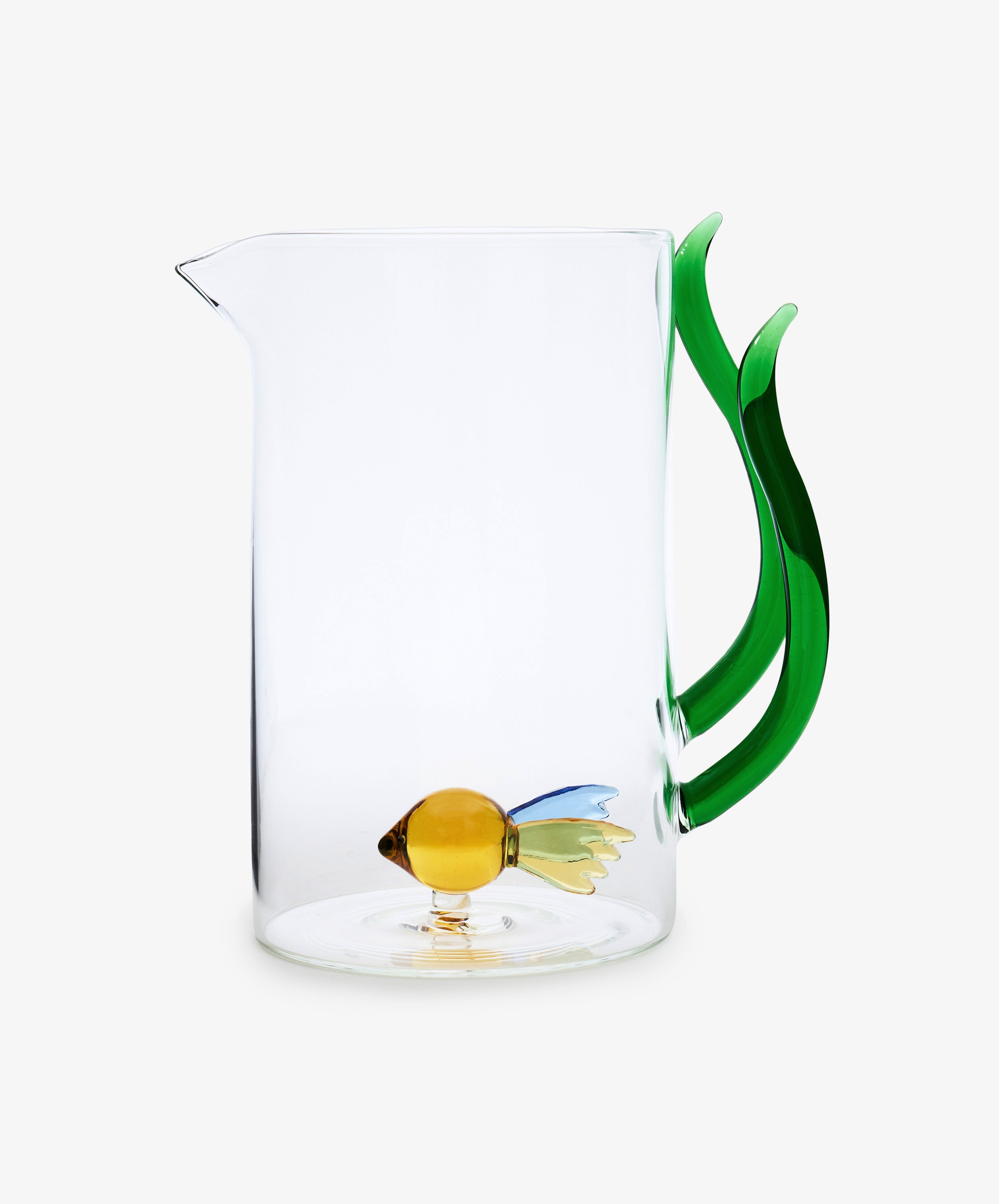 The Fish Pitcher is made from clear borosilicate glass, featuring a green seaweed-shaped handle and a small yellow hand-blown fish decoration at the bottom.