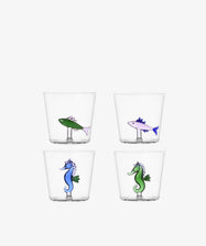 The Lido Tumbler Set of 4 features borosilicate glasses with playful aquatic designs: two fish and two seahorses illustrated at the base, all set against a plain white background.