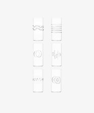 The Deco Tall Water Glass Set includes six clear glasses, each with a unique minimalist etched design—an elegant way to enhance your colorful glassware collection.