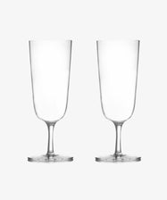 The Venezia Champagne Flute, Set of 6, features elegant handblown stemmed glasses. Two clear, empty flutes are displayed side by side on a plain white background, highlighting their timeless design.