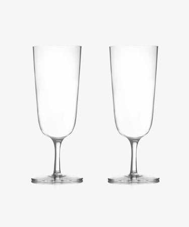 The Venezia Champagne Flute, Set of 6, features elegant handblown stemmed glasses. Two clear, empty flutes are displayed side by side on a plain white background, highlighting their timeless design.