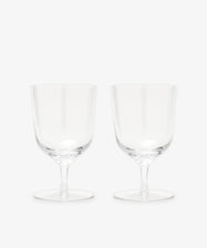 The Venezia Water Glass set of 6 features elegant, handblown clear glasses with short stems, displayed side by side on a plain white background—perfect glassware for any setting.