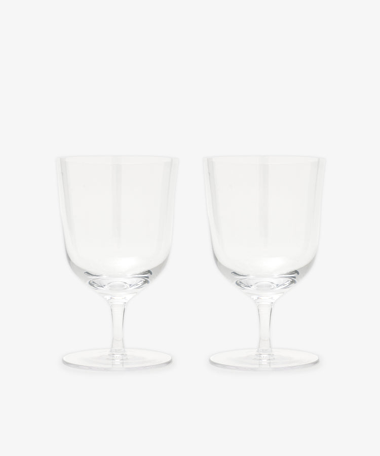 The Venezia Water Glass set of 6 features elegant, handblown clear glasses with short stems, displayed side by side on a plain white background—perfect glassware for any setting.