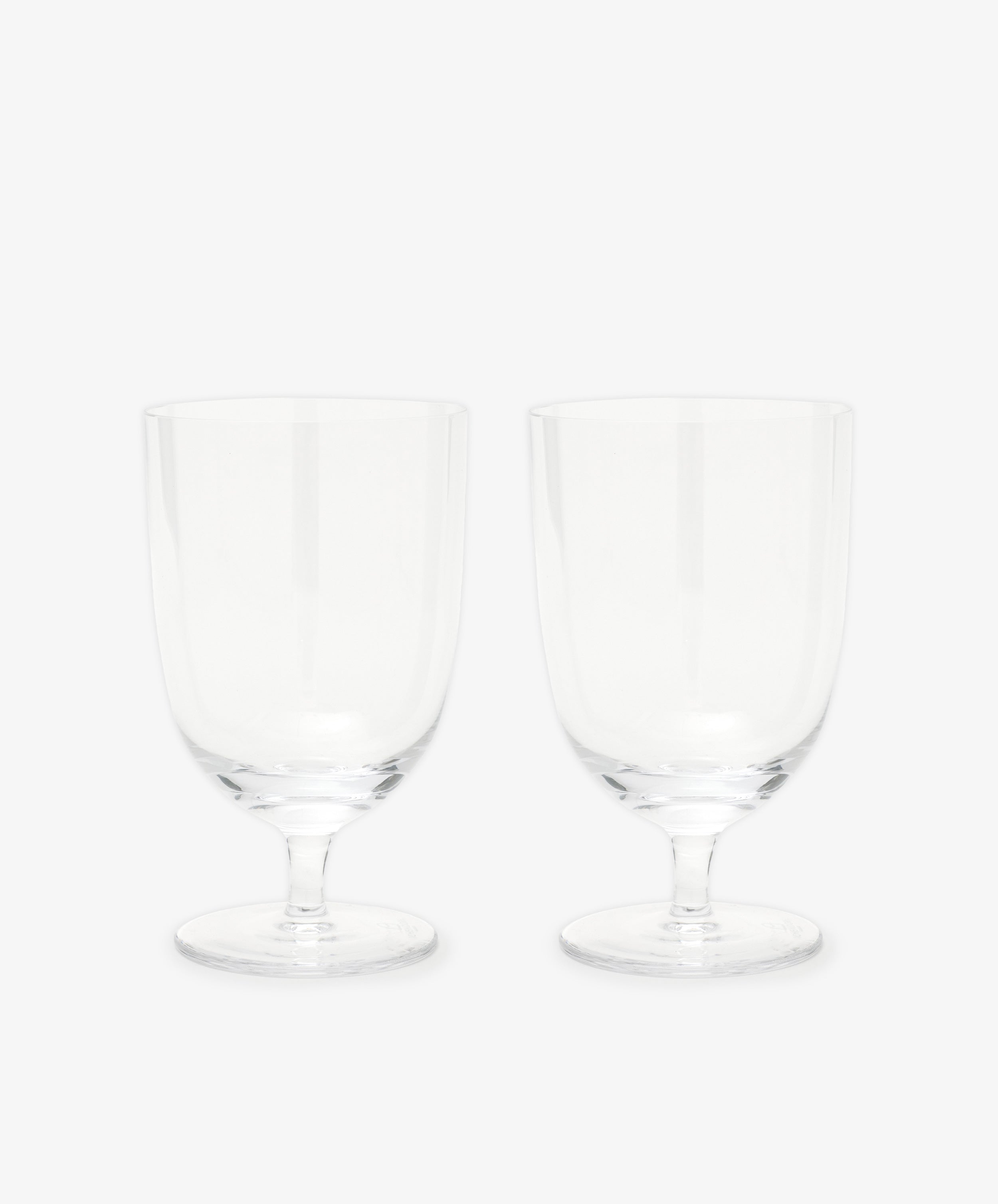 The Venezia Wine Glass, Set of 6 features elegant short-stemmed wine glasses displayed side by side on a plain white background, highlighting their clear and refined design.