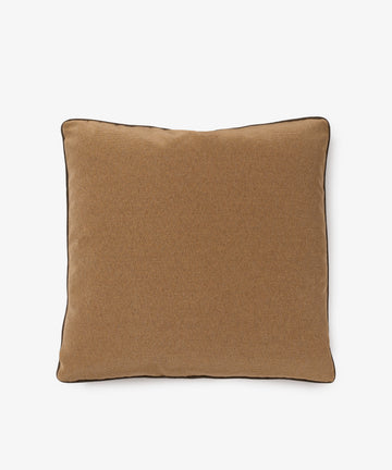 The Marco Square Cushion is a brown, square pillow with black-edged piping, handcrafted by a local upholsterer from premium deadstock fabrics and shown on a plain white background.