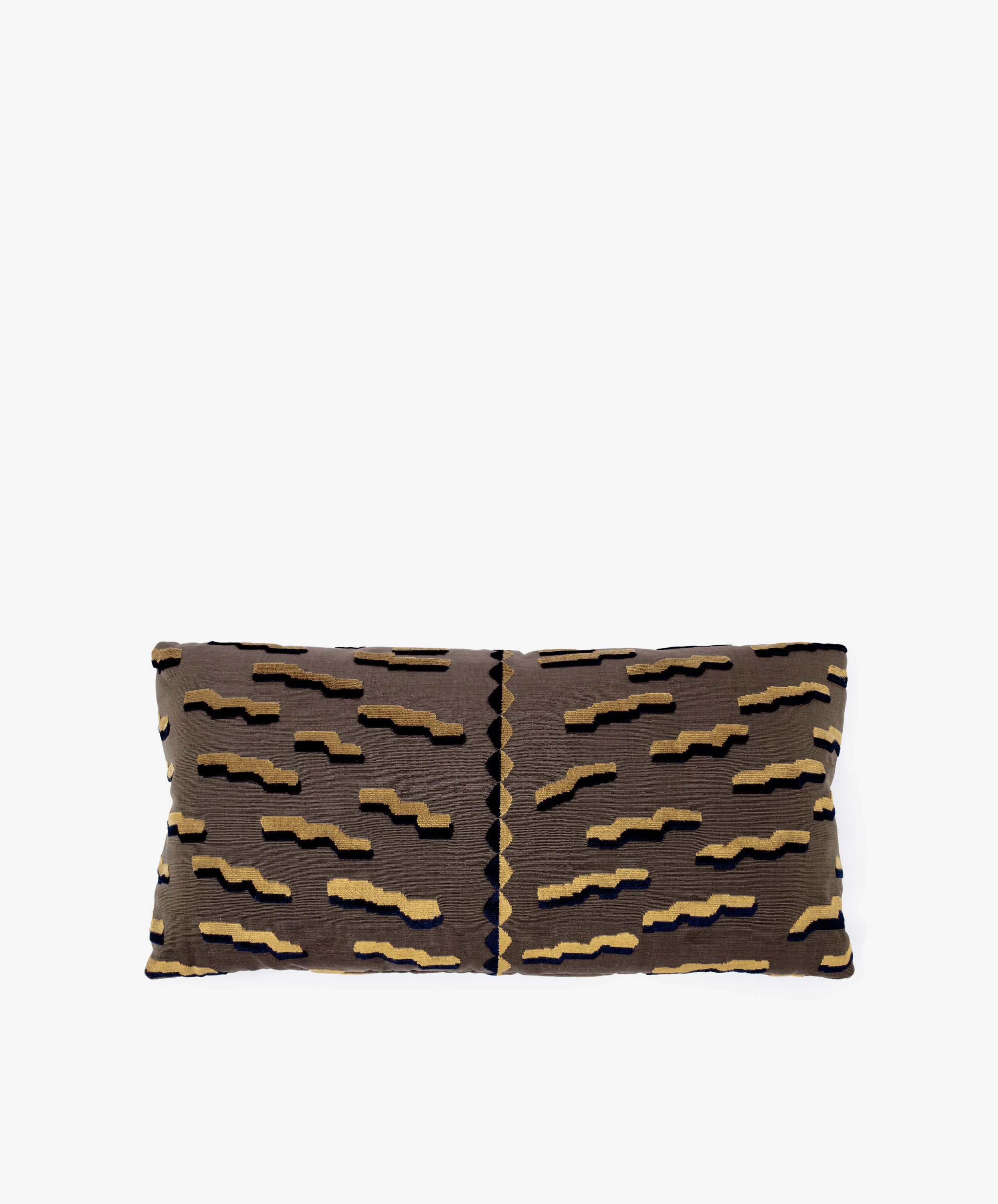 The Polo Lumbar Cushion is a rectangular pillow with a brown cover and abstract zigzag pattern in beige, black, and navy, made from deadstock designer fabric for premium quality and limited availability. Shown on a plain white background.