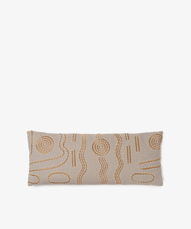 The Polo Lumbar Cushion is a rectangular beige cushion featuring an abstract pattern of brown and white stitched lines and circles, crafted from premium deadstock fabrics, displayed against a plain white background.