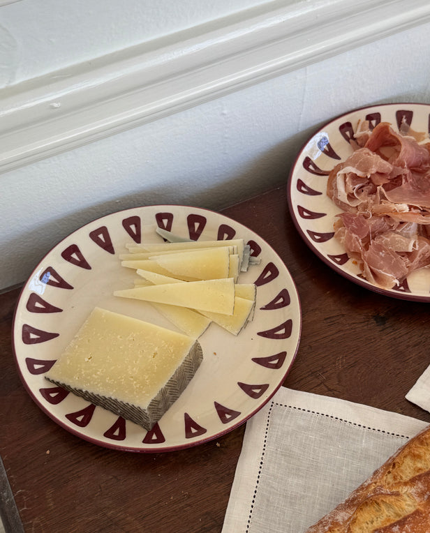 plate with cheese and plate with sliced meat