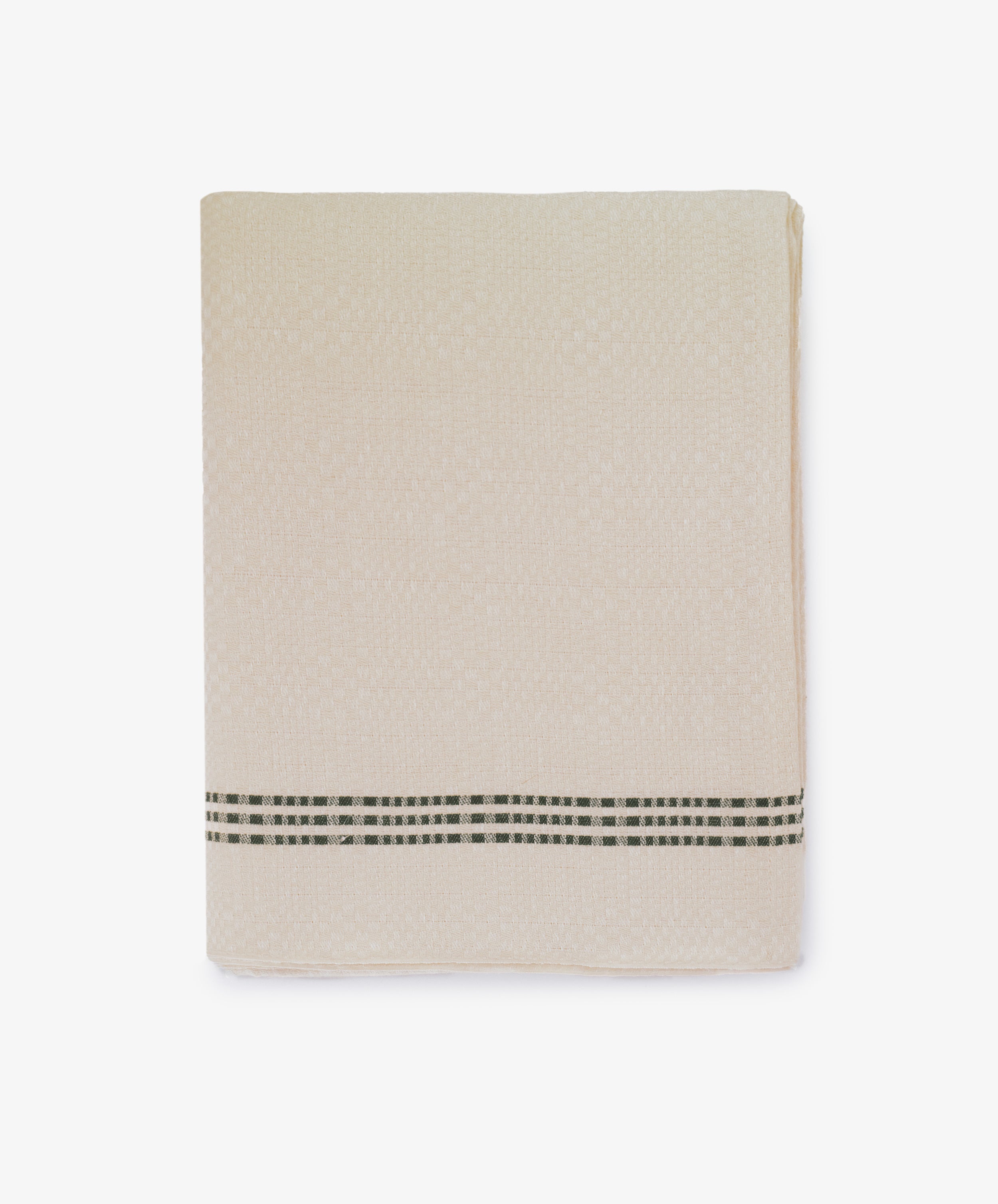 The Tilde Tablecloth, featuring a beige DaldrÃ¤ll weave and a black and white checked stripe near the edge, is neatly folded against a white background.