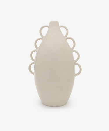 The Brisa Vase is a white ceramic piece with an oval shape and six sculptural loops on each side, featuring a minimal form against a plain white background.
