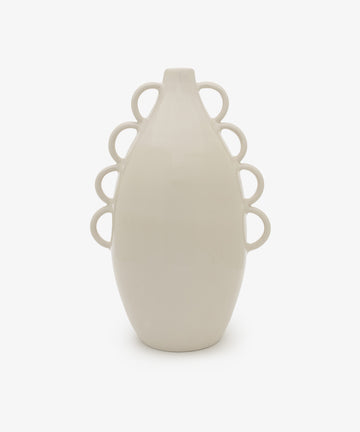 The Brisa Vase is a white ceramic piece with a minimal form and smooth surface, featuring six sculptural loops—three per side—for added charm, shown against a plain white background.