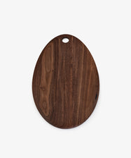 The Alden Egg Board is a dark walnut oval cheese board featuring a small hole near one end, displayed on a plain white background.