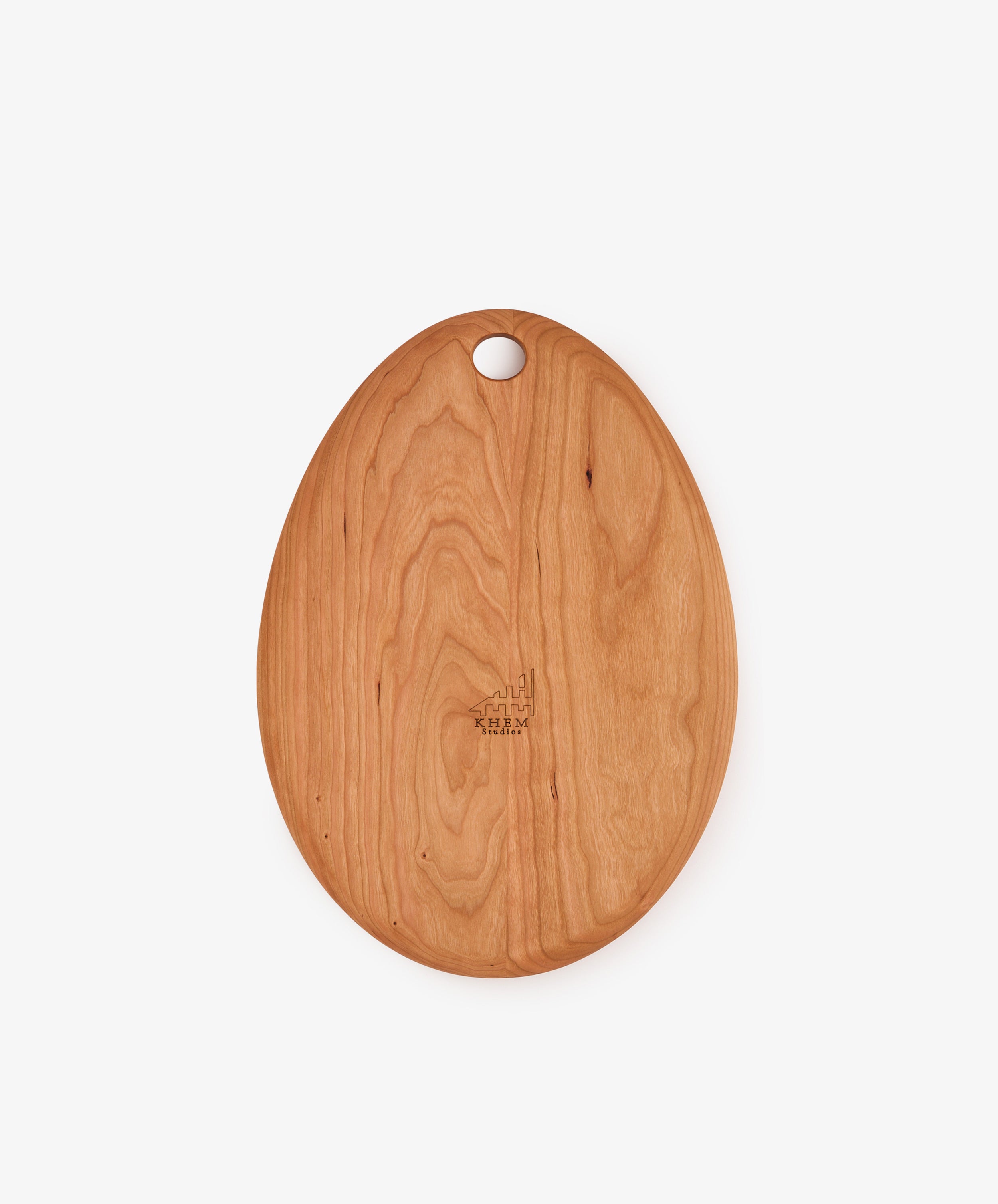 The Alden Egg Board is an oval wooden serving board featuring a small hole near the top for hanging, shown on a plain white background—perfect as a small cheese board for elegant presentations.