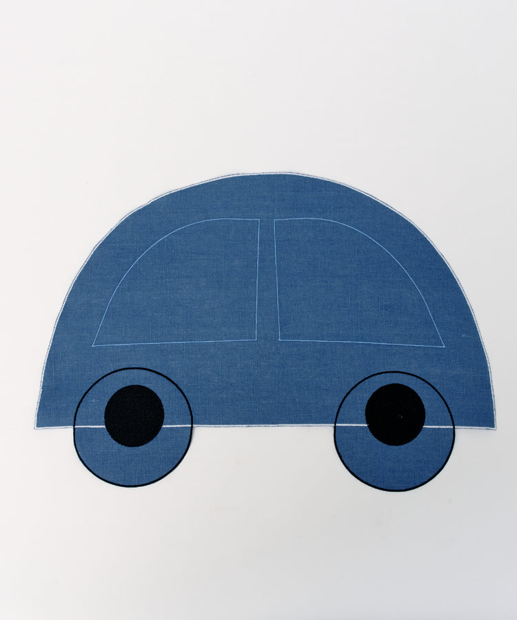 A fun kids placemat set featuring blue, semi-circle shaped cars with two black wheels on a white background. Product: Thomas Placemat, Set of 4.