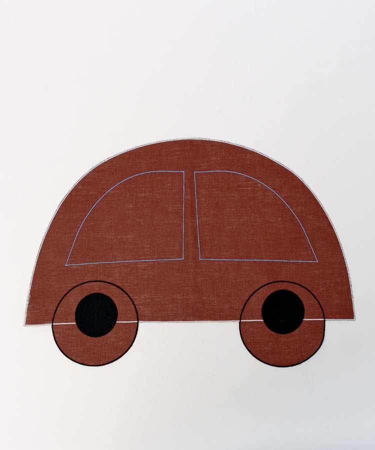 The Thomas Placemat, Set of 4, features a simple illustration of a brown car with black wheels on a white background—ideal for kids’ placemats that make mealtimes fun and easy to clean.