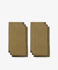 The Flavia Napkin, Set of 6, features brown linen napkins with black trim and a double-line stitch, elegantly arranged on a plain white background.