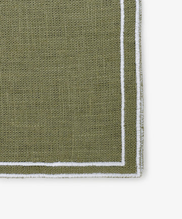 Close-up of a textured olive green Flavia Napkin (Set of 6) with white double-line stitched borders, shown on a white background.
