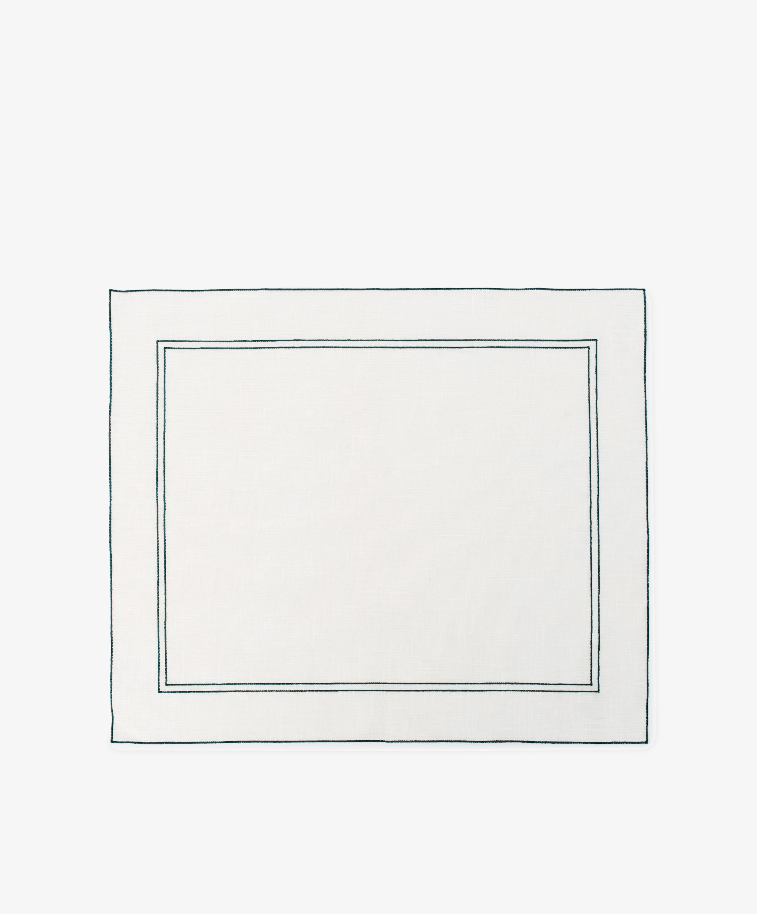 The Flavia Placemat, Set of 6, features rectangular white linen with two thin dark-bordered outlines near the edges—a refined and durable choice for elegant table settings.