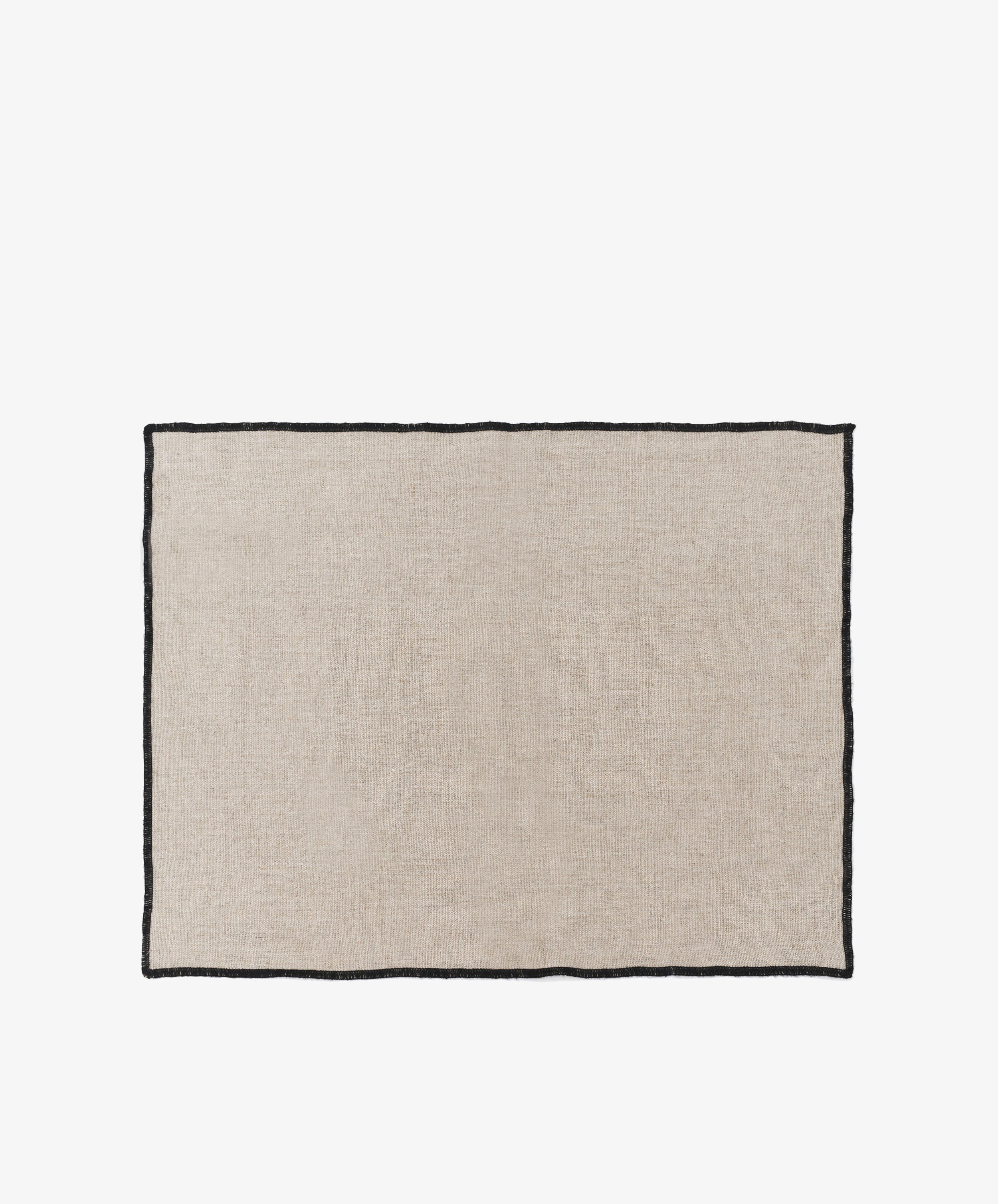 Luri Placemat. Rectangular natural linen mat with black stitched edges.