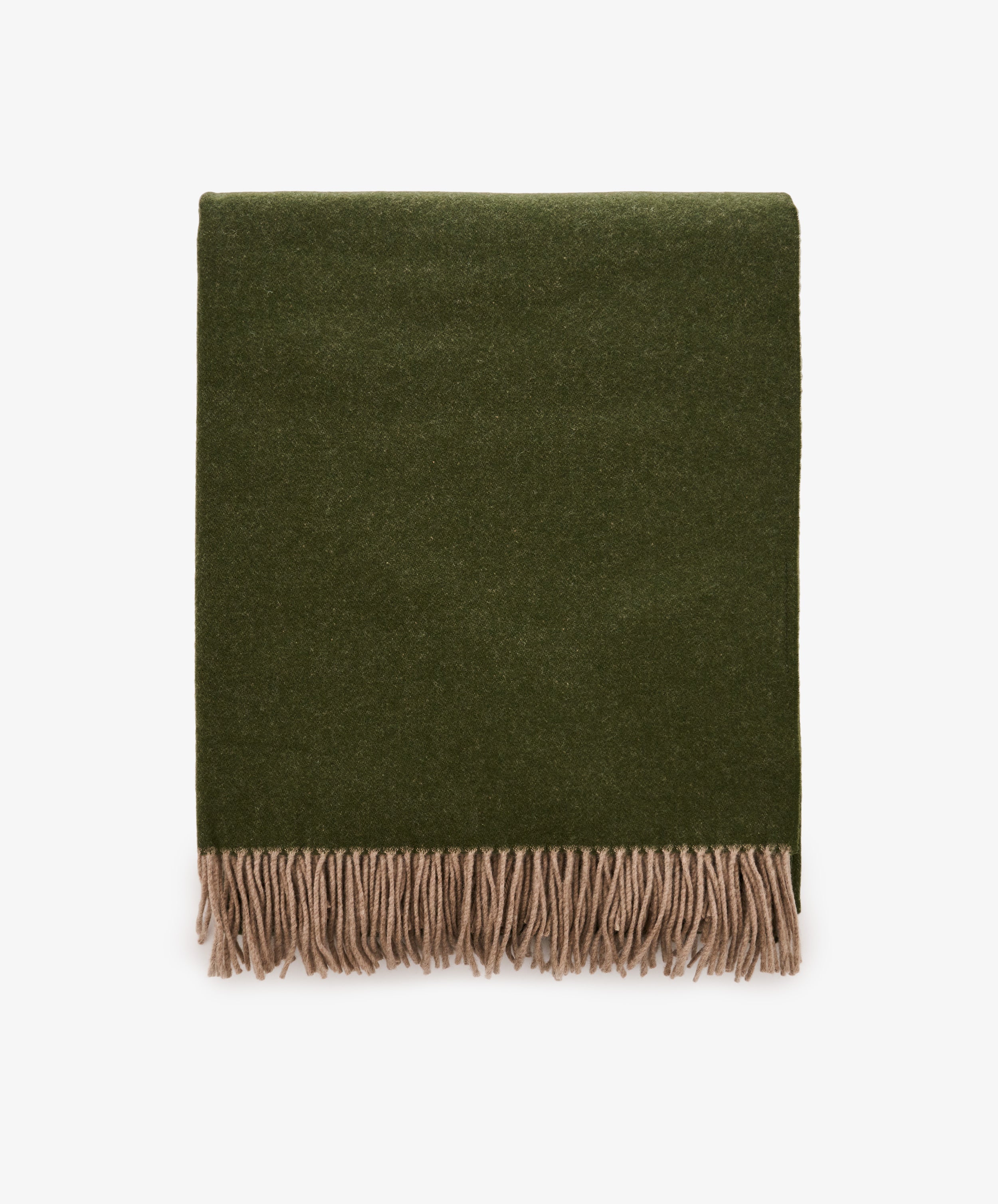 A folded Ulisse Throw in forest green with beige fringe along the bottom edge, displayed on a white background.