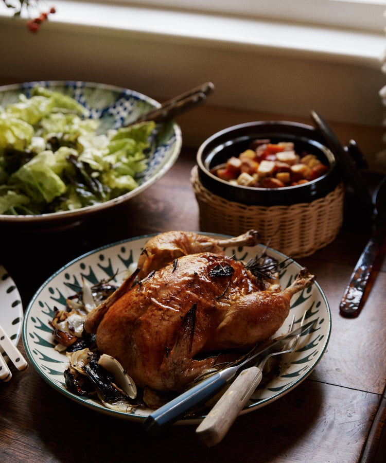 Serve roast chicken on the Vito Serving Platter with salad and veggies, set on a wooden table—perfect as a unique gift for any occasion.