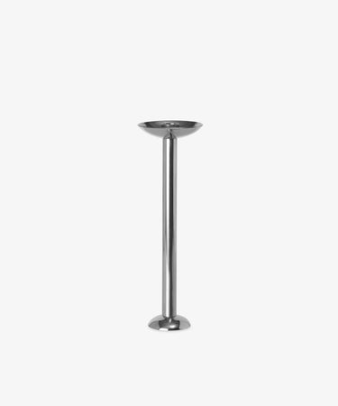 The Metal Champagne Candle Holder is a tall, polished stainless steel piece with a round base and shallow top, shown against a plain white background.