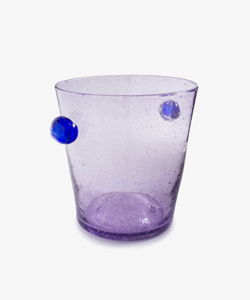 The Vincent Vase / Ice Bucket is a transparent purple glass piece with two small blue decorative knobs, hand blown in a contemporary design and shown against a plain white background.